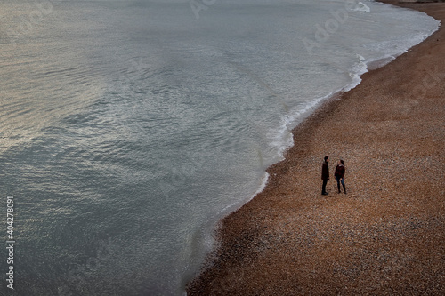 lovers on Brighton beach in the day