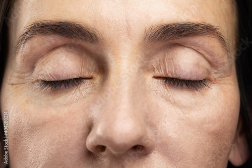 Bild auf Leinwand Tired eyes of middle aged woman