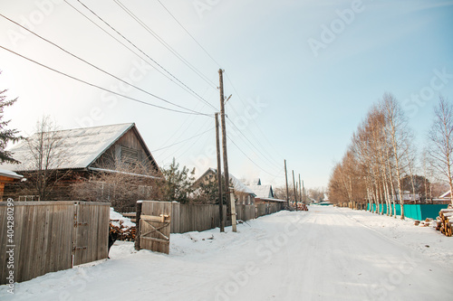 Snowy winter in russian village. Siberia, frost