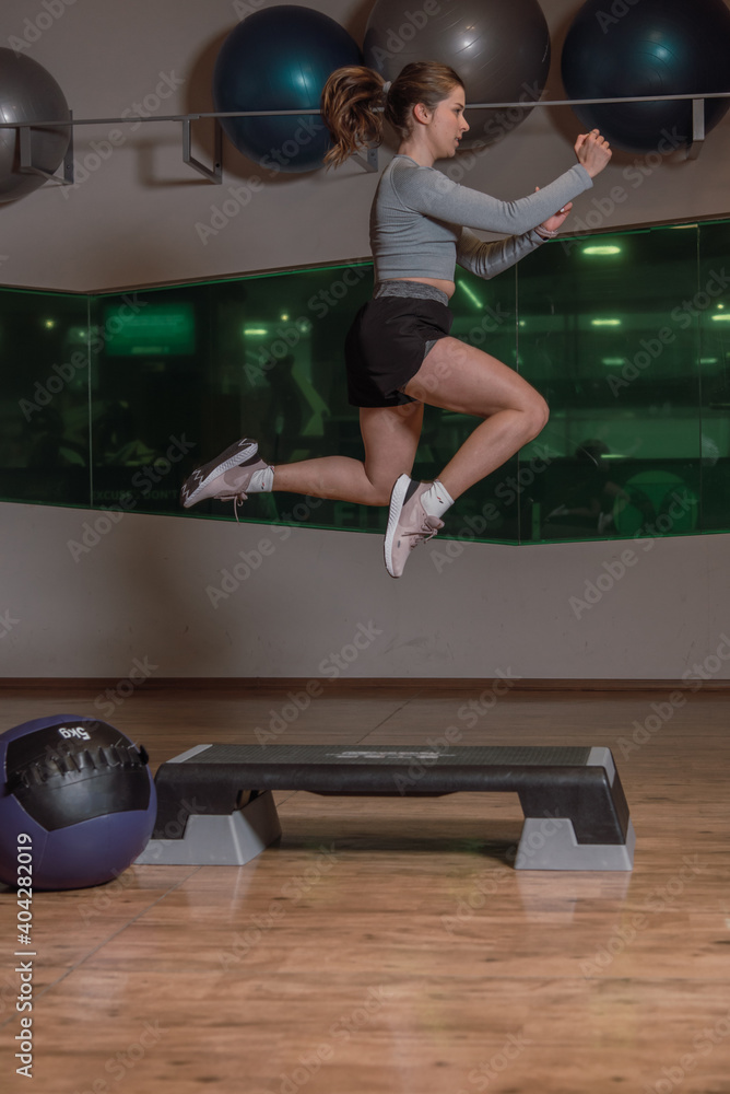 Female in the middle of a quick HIIT cardio for better looking shape Female in the middle of a quick HIIT cardio for better looking shape