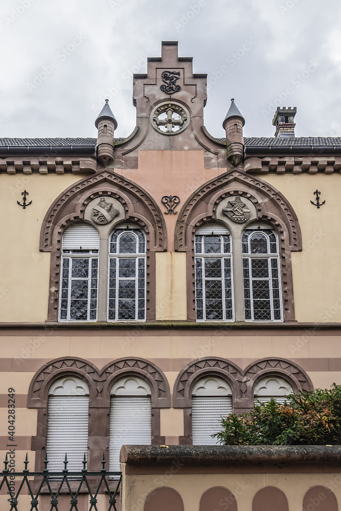 Obraz premium Fragments of old building of Circle Catholic Saint-Martin, created in 1880 - 72-meter-long building combines neo-Romanesque and neo-gothic styles. Colmar, Alsace, France.
