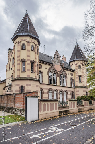 Fragments of old building of Circle Catholic Saint-Martin, created in 1880 - 72-meter-long building combines neo-Romanesque and neo-gothic styles. Colmar, Alsace, France.