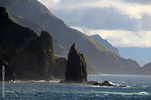 Priest Rock is a rock formation on the coast of Unalaska Island, photographed from the Unalaska Bay 