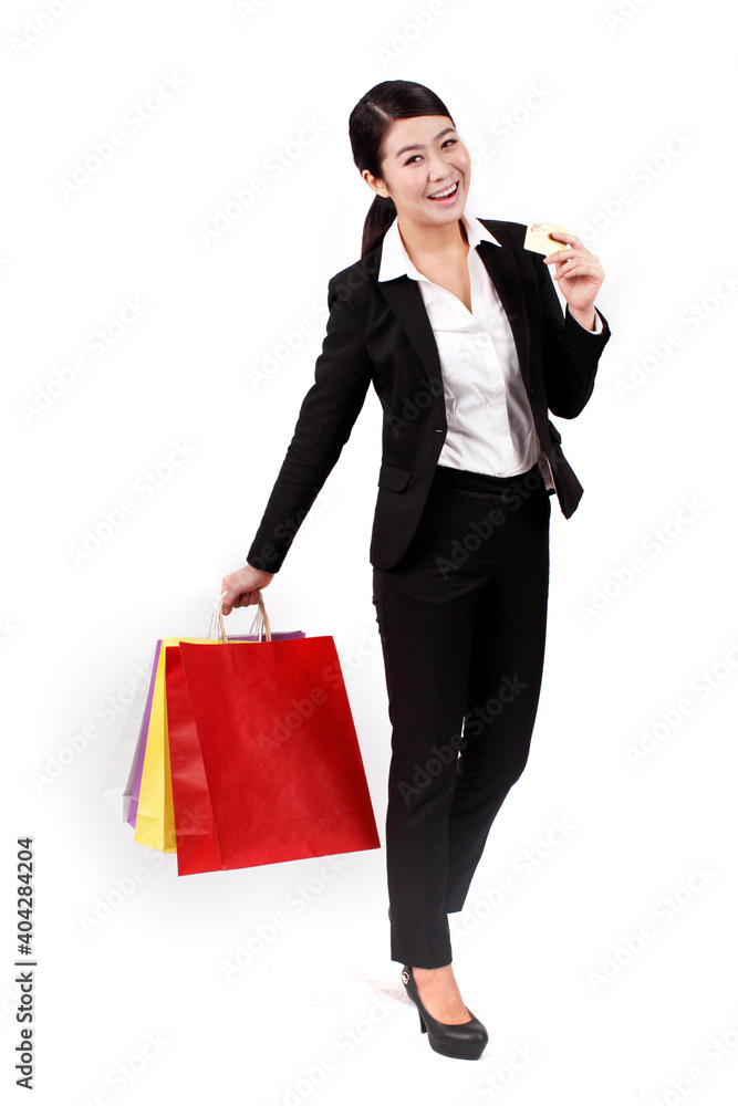 Businesswoman holding credit card and shopping bag Businesswoman holding credit card and shopping bag