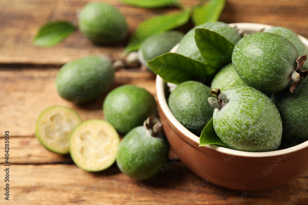 Fresh green feijoa fruits on wooden table, closeup. Space for text Fresh green feijoa fruits on wooden table, closeup. Space for text