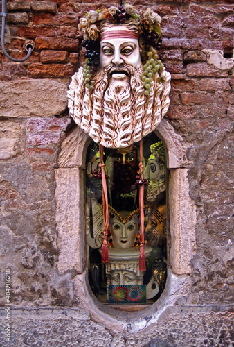 Traditional colourful and intetesting shop decoration in Venice Italy photo