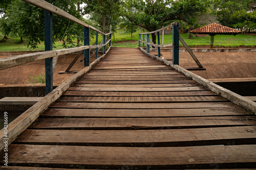 wood bridge.in the jump of the river apore photo