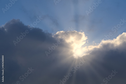 beautiful clouds with blue sky and sun rays