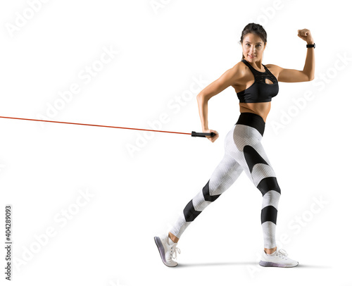 Fitness woman performs exercises with resistance band © Andrey Burmakin