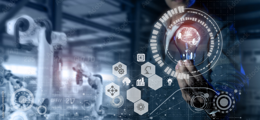 smart industry 4.0 futuristic technology concept, engineer hold the light bulb with the brain of artificial intelligence to control robot with analytic operation robotic process line in manufactoring smart industry 4.0 futuristic technology concept, engineer hold the light bulb with the brain of artificial intelligence to control robot with analytic operation robotic process line in manufactoring