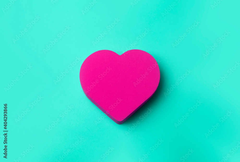 Valentine's day background. Red heart on a green minimal background. Love, romance and heart concept. Valentine's day background. Red heart on a green minimal background. Love, romance and heart concept.