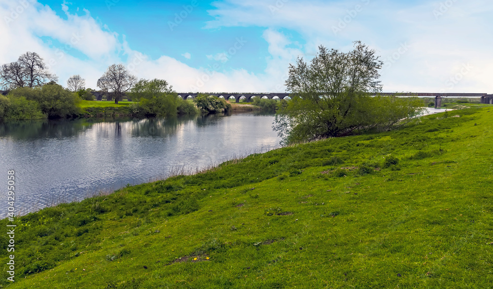A view along the River Trent towards the abandoned railway viaduct at Fledborough, Nottinghamshire in springtime