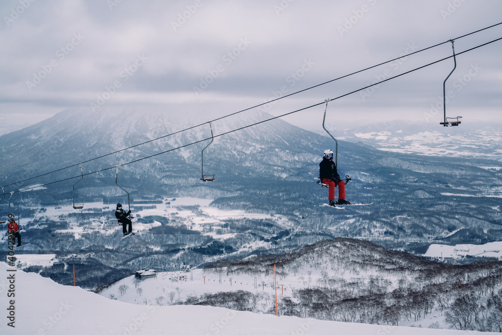 Skiers on chair lift