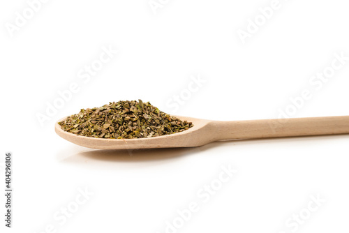 Oregano spice in wooden spoon isolated.