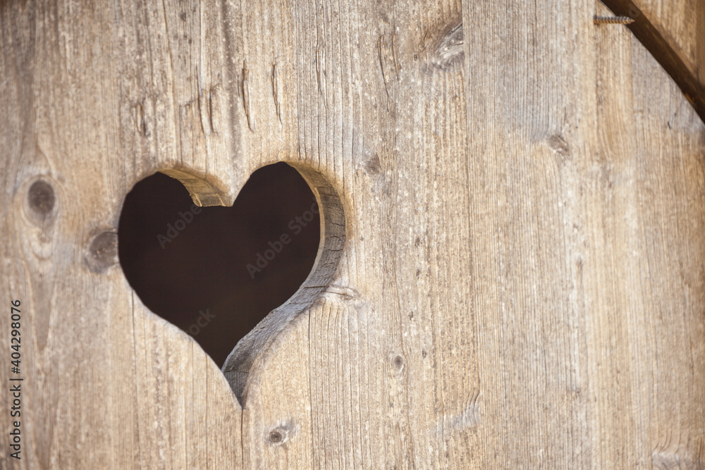 hearth shape over a wooden balcony in a small alpine cabine hearth shape over a wooden balcony in a small alpine cabine