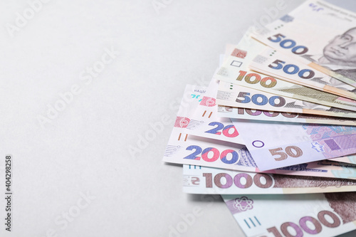 Ukrainian money on white background, closeup. Space for text