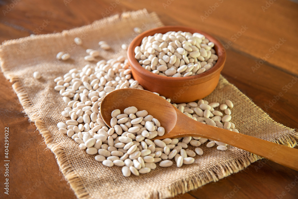Dry beans in ceramic bowl. Isolated top view. Dry beans in ceramic bowl. Isolated top view.