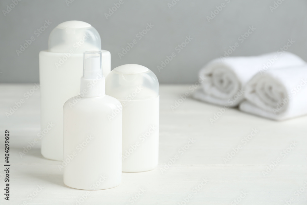 Different cosmetic products on white wooden table, space for text. Lice treatment Different cosmetic products on white wooden table, space for text. Lice treatment
