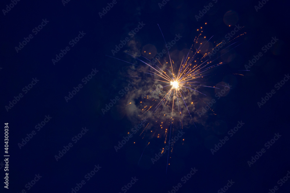 Fototapeta premium Abstract brightly colorful colored fireworks background on a twilight background with free space for text. Celebration and holiday concept