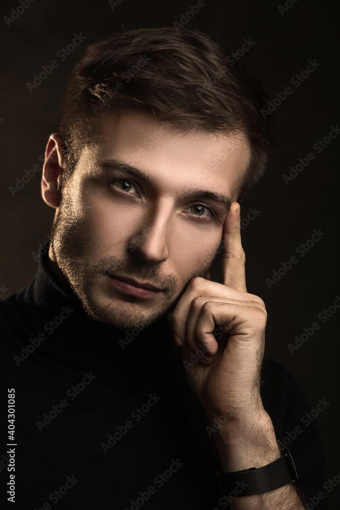 Young handsome man wearing a polo neck