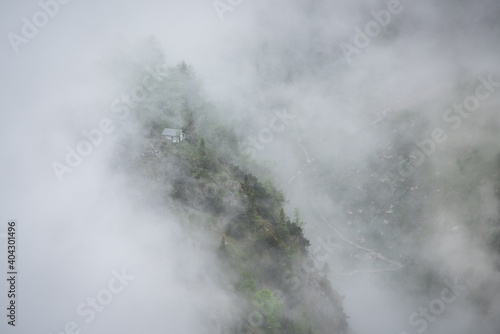 Small house in the clouds in the mountains of the Bavarian alps near Garmisch Partenkirchen