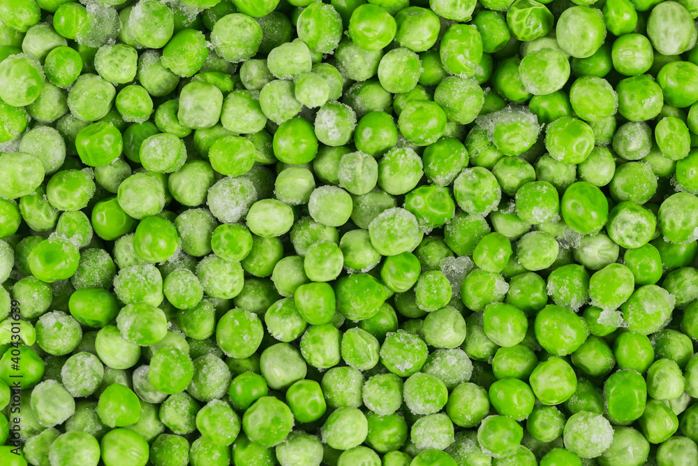Frozen green peas as a background. Concept of homemade preparations for fast cooking. Healthy vegetarian food concept Frozen green peas as a background. Concept of homemade preparations for fast cooking. Healthy vegetarian food concept