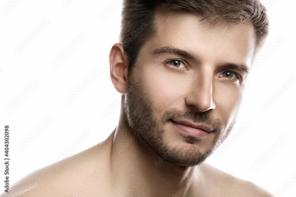 Young and handsome man with smooth skin on white background Young and handsome man with smooth skin on white background