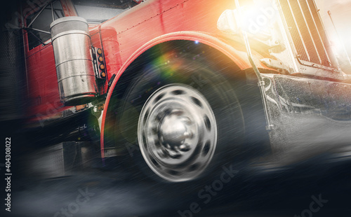 Speeding Powerful Semi Truck in Heavy Rain photo