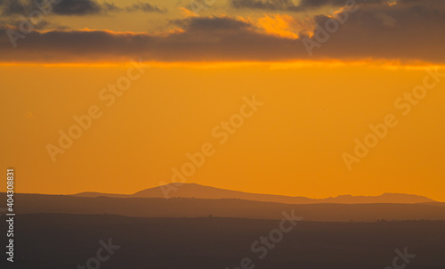 Yellow sunset over the mountains