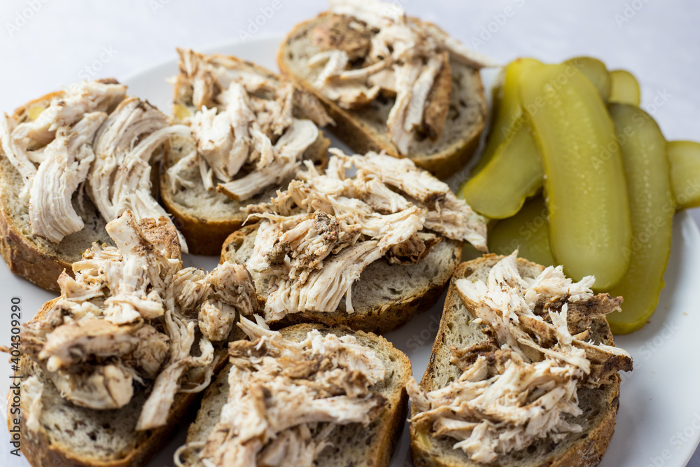 Sandwiches with chicken and pickled cucumber.