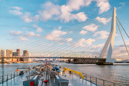 Binnenvaart, Translation Inlandshipping on the river Nieuwe Maas Rotterdam Netherlands during sunset hours, Gas tanker vessel Rotterdam oil and gas transport. Netherlands