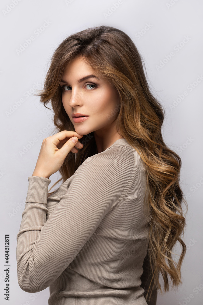 Portrait of young pretty woman with a curly hairstyle Portrait of young pretty woman with a curly hairstyle