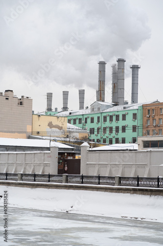 Sadovnicheskaya Embankment of the Vodootvodny Canal, the pipes of the heating plant are smoking, Moscow photo