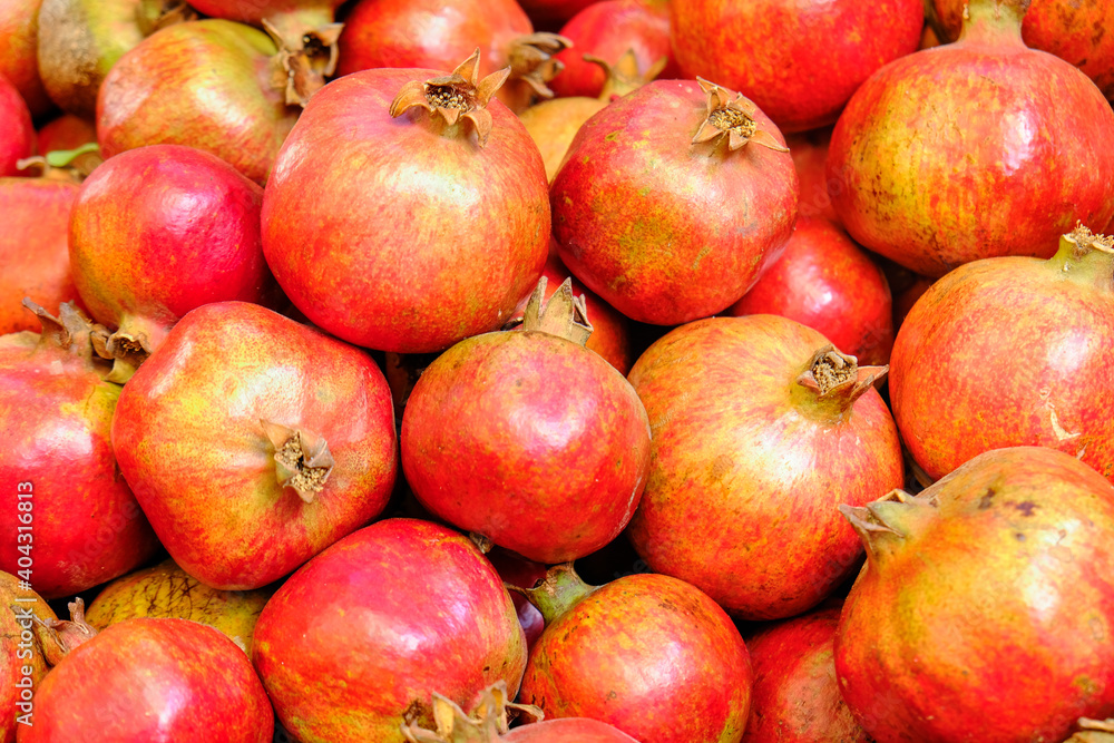 Pomegranate fruit. Fresh, delicious and healthy food. Freshly harvested and whole pomegranate for sell on market. Pomegranate fruit. Fresh, delicious and healthy food. Freshly harvested and whole pomegranate for sell on market.