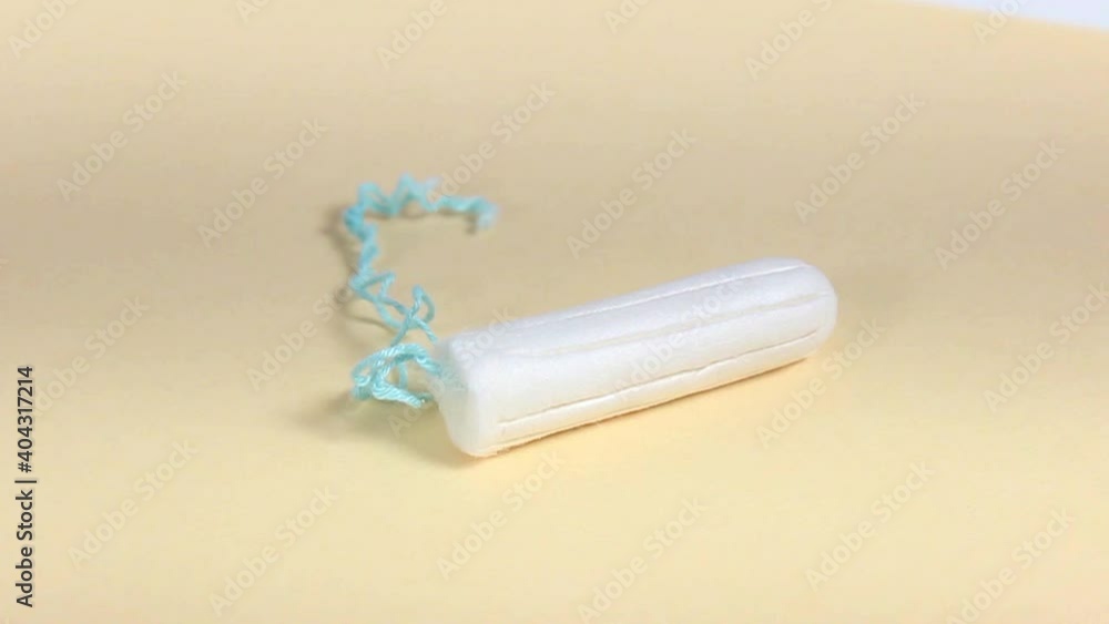 Cotton swab for women's hygiene. Protection during menstruation. Turntable. Close-up. Cotton swab for women's hygiene. Protection during menstruation. Turntable. Close-up.
