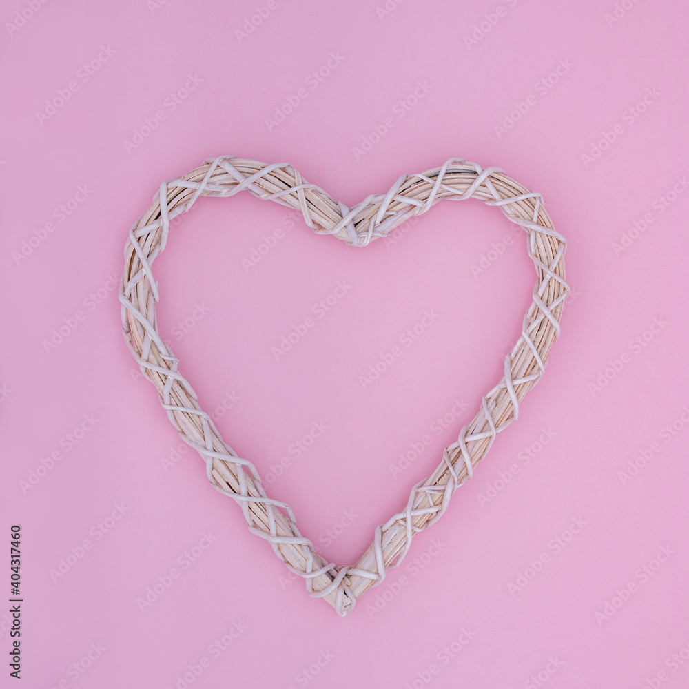 Creative minimal concept with heart symbol made of twigs on pastel pink background. Flat lay design Creative minimal concept with heart symbol made of twigs on pastel pink background. Flat lay design