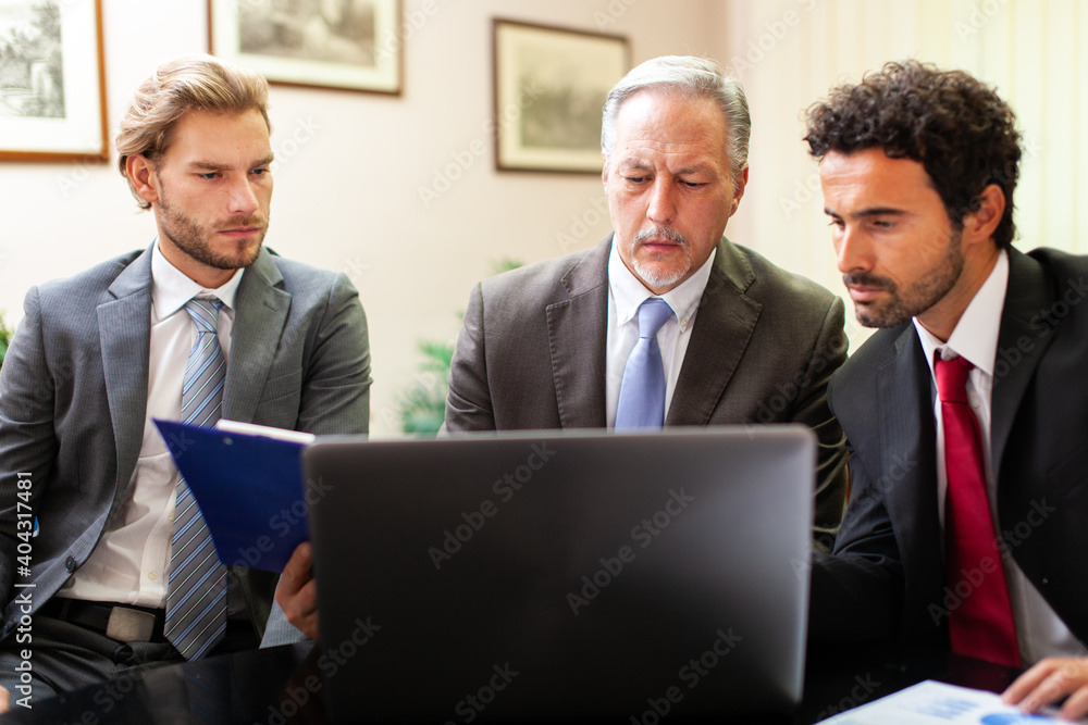 Business people at work together in an office Business people at work together in an office