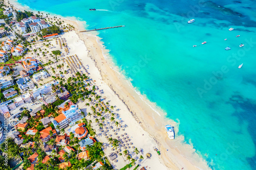 Aerial drone view of beautiful caribbean tropical beach with palms and boats. Bavaro, Punta Cana, Dominican Republic. Vacation background. photo