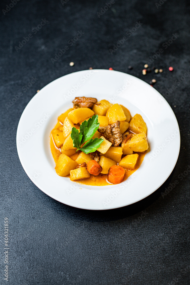 goulash with potatoes and meat stewed vegetables and pork ready to eat on the table for healthy meal snack outdoor top view copy space for text food background rustic image goulash with potatoes and meat stewed vegetables and pork ready to eat on the table for healthy meal snack outdoor top view copy space for text food background rustic image