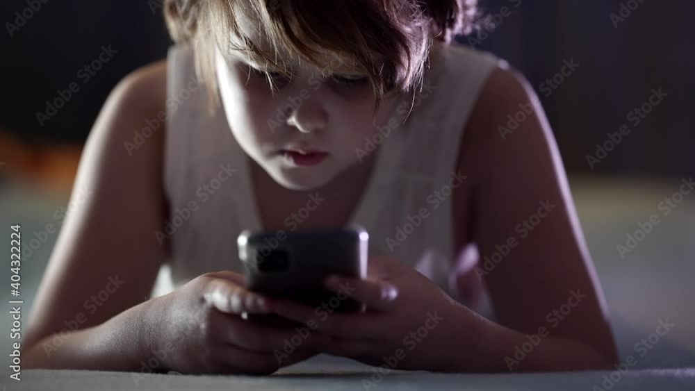 child is using smartphone at night, playing video games, surfing internet child is using smartphone at night, playing video games, surfing internet