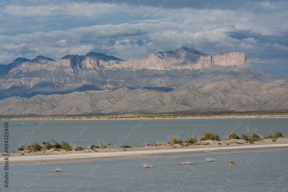 Guadalupe Mountains high peaks panorama with rare desert lake and dramatic clouds in West Texas