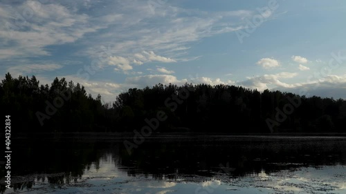 Moving clouds during sunset over Danube river in summer season near Bratislava, Slovakia. Summer in wetland.
