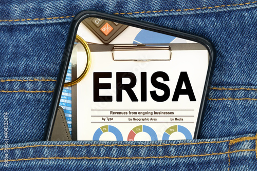 In a pocket of jeans there is a smartphone on the screen of which the text - ERISA photo