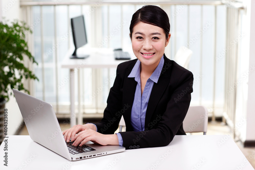 A young Business woman using a laptop A young Business woman using a laptop