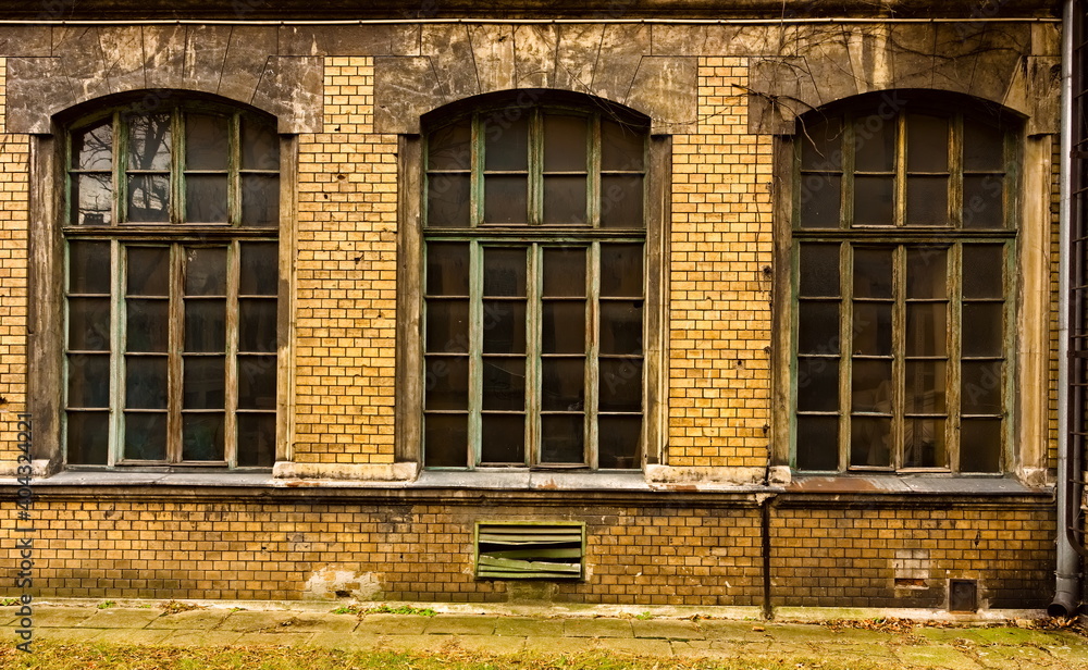 three large old windows in an old disused building. old building with windows three large old windows in an old disused building. old building with windows