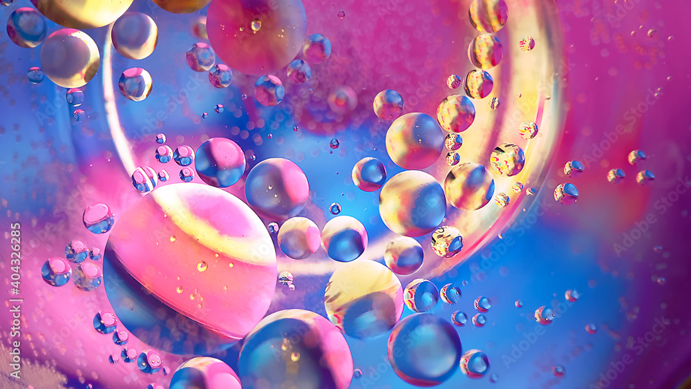Space abstract macro background of oil mixed with water on colorful gradient Space abstract macro background of oil mixed with water on colorful gradient