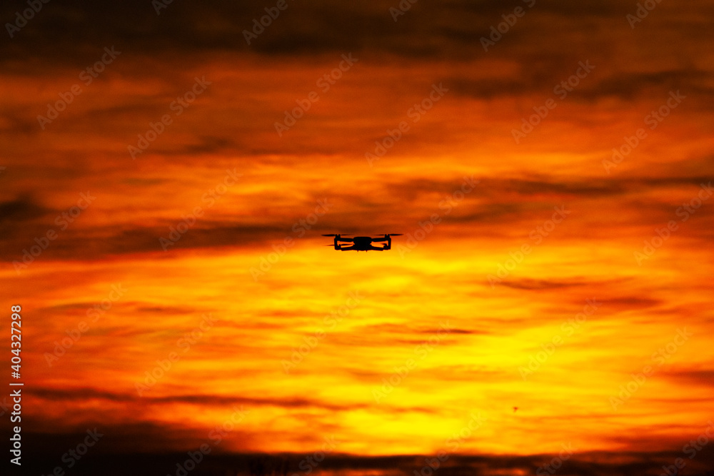 Fototapeta premium Drone in flight with sunset - DJI Mini 2