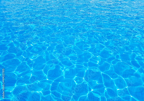 Sunny abstract blue water background. Mobile photography of rippling waterpool