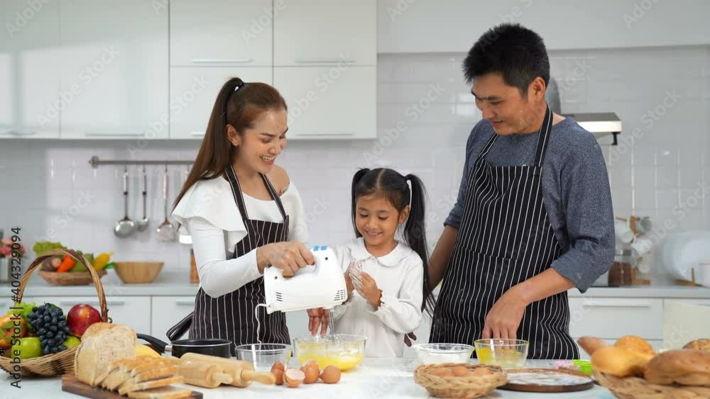 Asian family fun cooking bakery pastry home together , happy smiling enjoy weekend , spend weekend together, happy family concept. Asian family fun cooking bakery pastry home together , happy smiling enjoy weekend , spend weekend together, happy family concept.