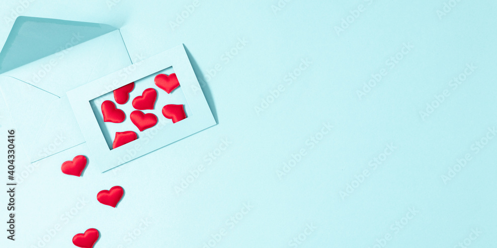 Creative minimal Valentine's Day concept. Envelopes, red hearts confetti, valentines on pastel blue background. Flat lay, top view, copy space Creative minimal Valentine's Day concept. Envelopes, red hearts confetti, valentines on pastel blue background. Flat lay, top view, copy space